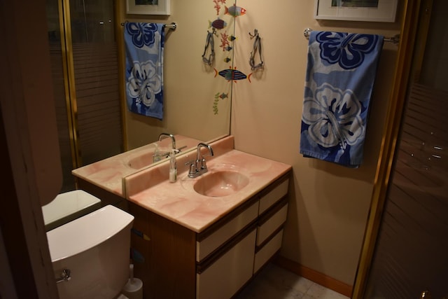 1407 Country Club Ln, Loda, IL 60948 - bathroom featuring toilet, vanity, and baseboards