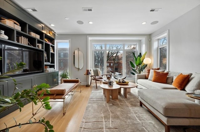 living room with light hardwood / wood-style floors