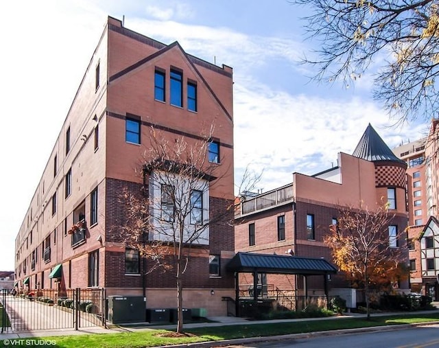 view of property featuring central AC unit