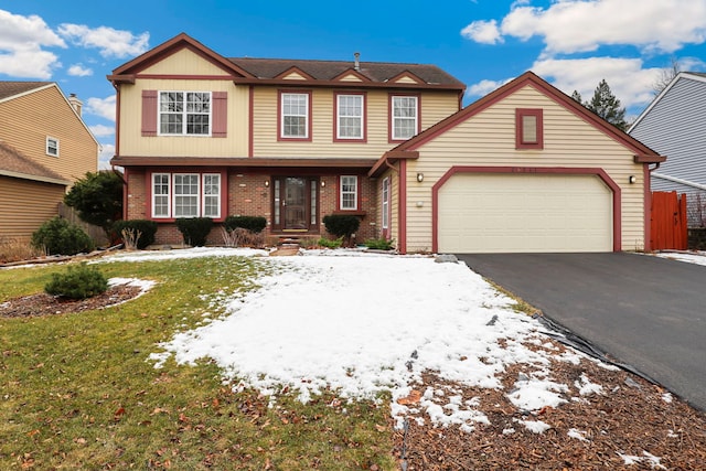 view of front of home with driveway, brick siding, and an attached garage