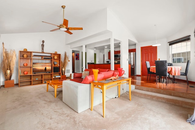 living room featuring ceiling fan, carpet floors, high vaulted ceiling, and visible vents