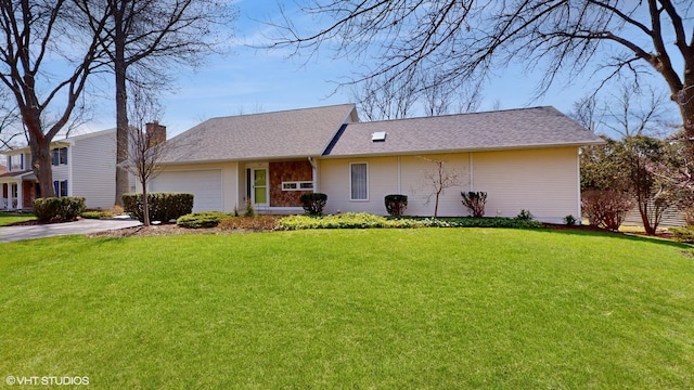 view of front facade featuring driveway, a chimney, an attached garage, and a front yard