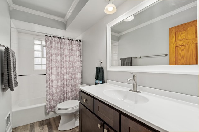 full bathroom featuring visible vents, toilet, wood finished floors, crown molding, and vanity