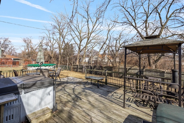 deck with a gazebo, a fenced backyard, a grill, and outdoor dining space