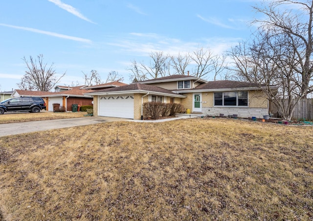 view of front of property featuring driveway, an attached garage, fence, a front lawn, and brick siding