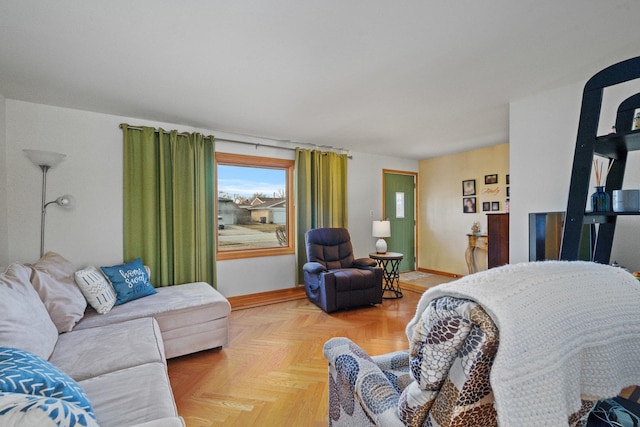 living area featuring baseboards