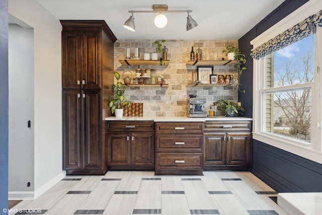 bar with backsplash and baseboards