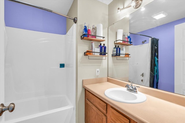 bathroom featuring vanity and shower / bath combo
