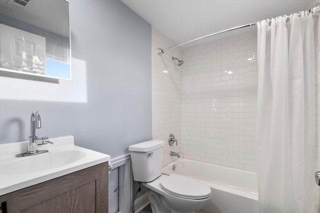 full bathroom with shower / bath combination with curtain, vanity, and toilet