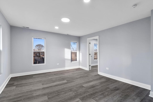 empty room featuring dark hardwood / wood-style floors