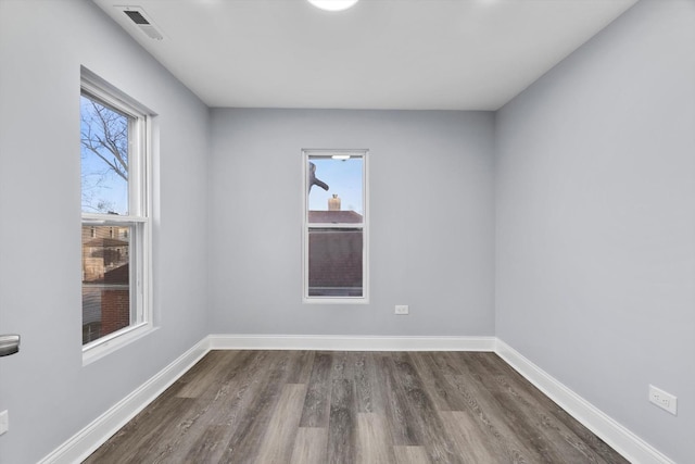 empty room featuring dark hardwood / wood-style floors