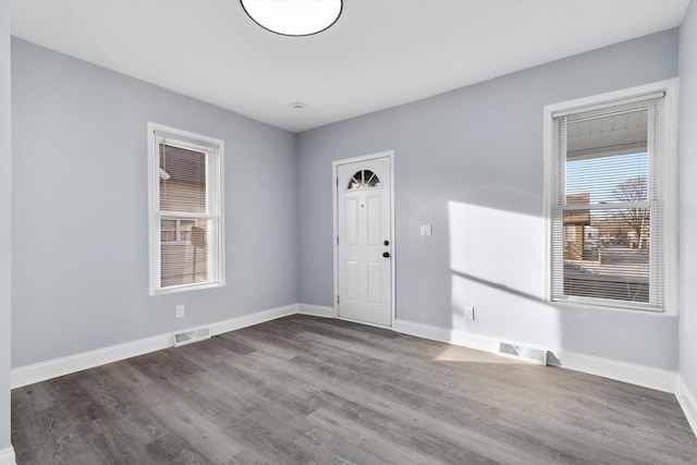 entrance foyer with dark hardwood / wood-style flooring