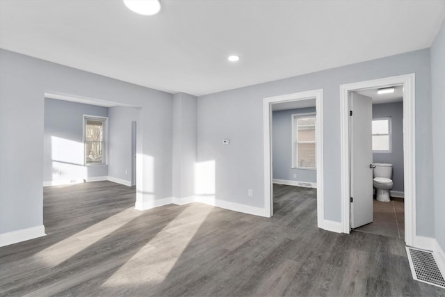 unfurnished room featuring dark hardwood / wood-style floors
