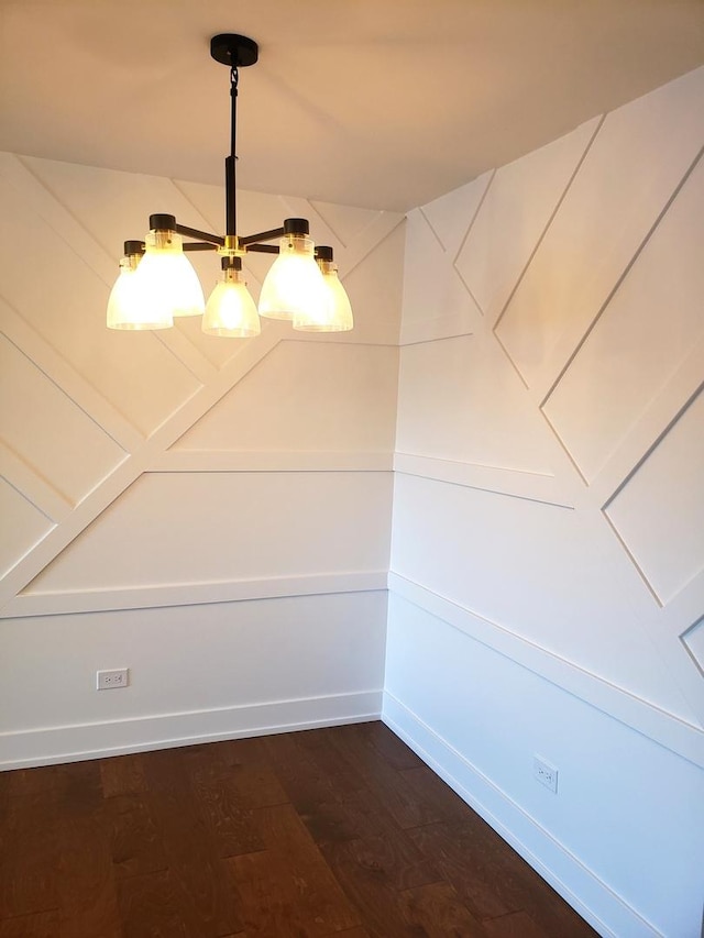 unfurnished dining area featuring hardwood / wood-style flooring