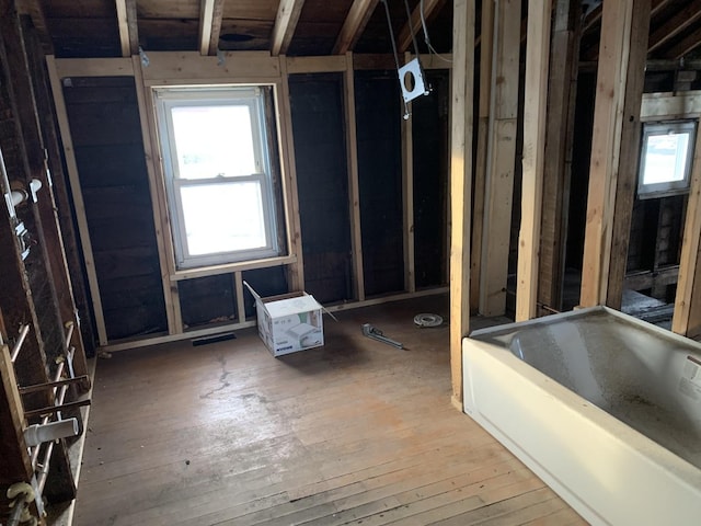 bathroom with hardwood / wood-style flooring