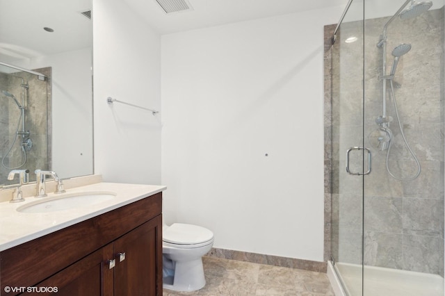 bathroom featuring vanity, an enclosed shower, tile patterned flooring, and toilet