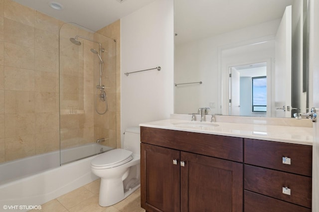 full bathroom with vanity, toilet, tiled shower / bath combo, and tile patterned flooring