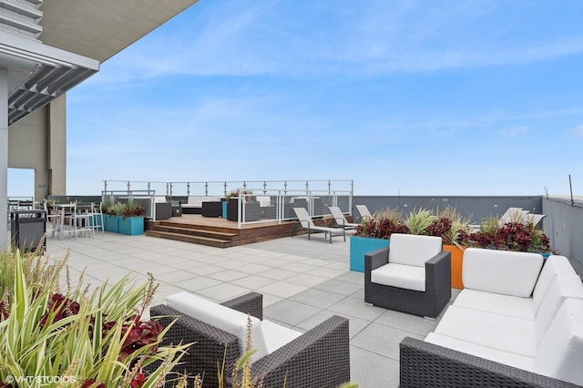 view of patio / terrace featuring a water view and an outdoor hangout area