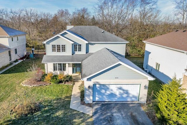 view of front property with a porch, a garage, and a front yard