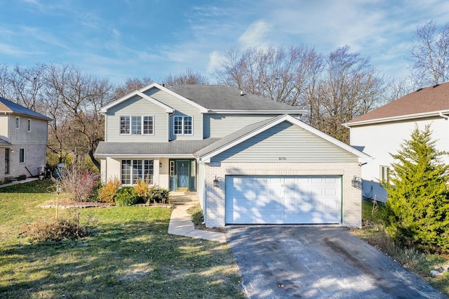 front facade featuring a garage and a front yard