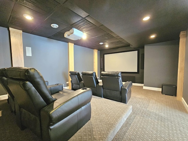 home theater featuring carpet floors and a drop ceiling