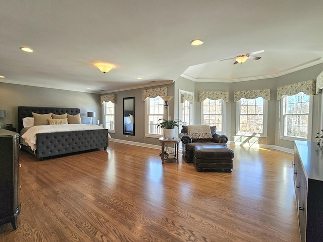 bedroom with hardwood / wood-style floors and crown molding