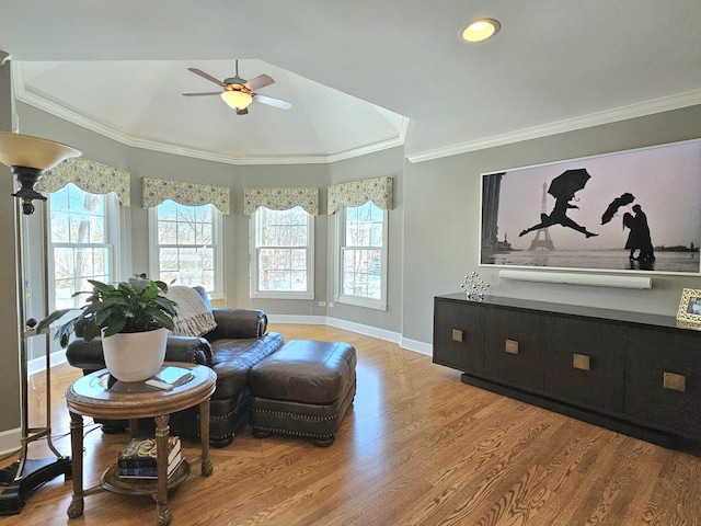 sitting room with crown molding, ceiling fan, light hardwood / wood-style flooring, and a wealth of natural light