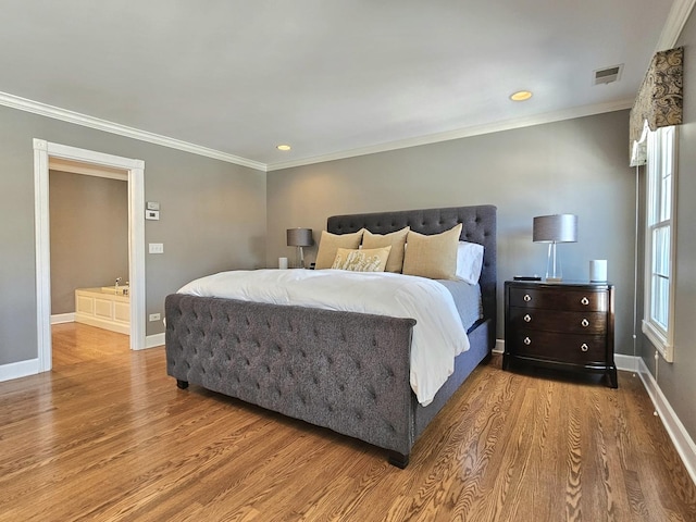 bedroom with light hardwood / wood-style flooring and ornamental molding