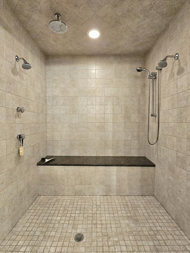 bathroom with a tile shower