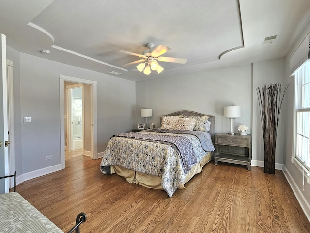 bedroom featuring hardwood / wood-style floors and ceiling fan