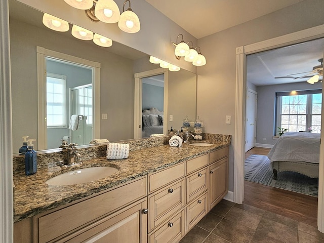 bathroom featuring ceiling fan, vanity, and tile patterned floors