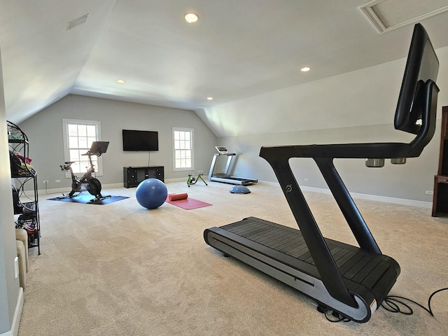 exercise area featuring lofted ceiling and light colored carpet