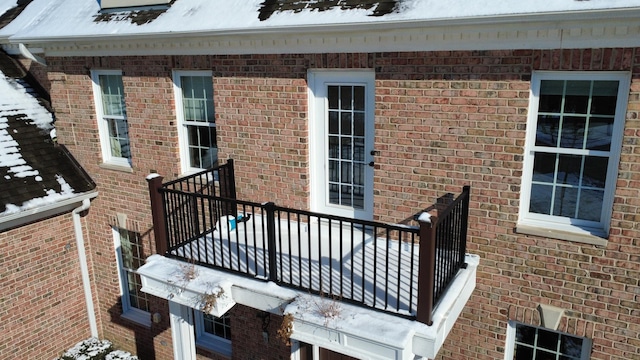 view of snow covered property entrance