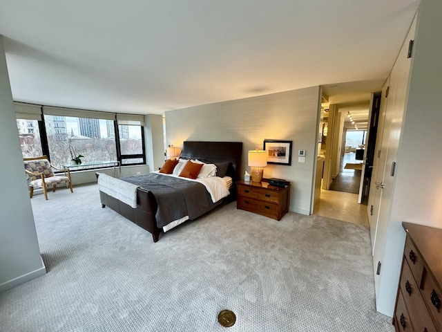 bedroom with light colored carpet