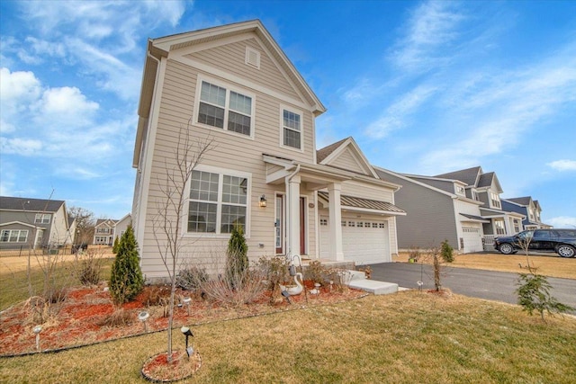 view of front of property with a front lawn and a garage