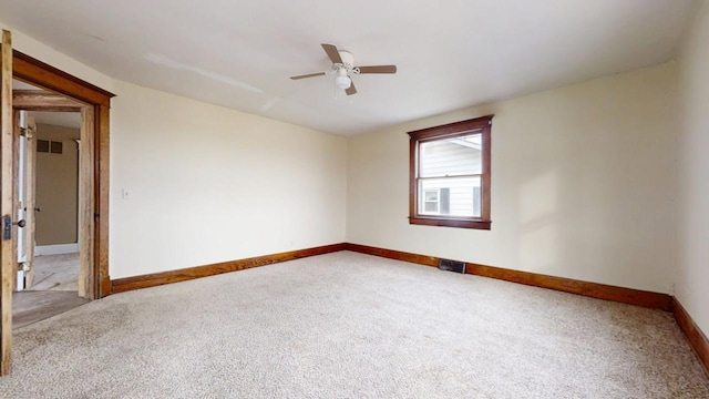 empty room featuring ceiling fan and carpet floors