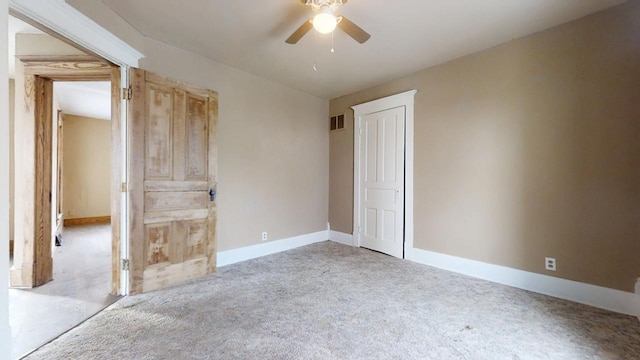 spare room with light carpet and ceiling fan