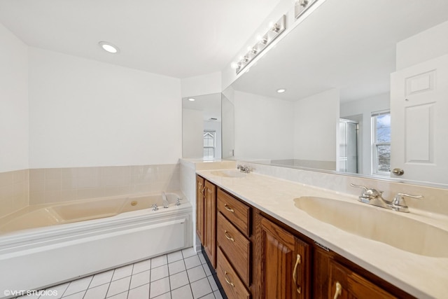 full bathroom featuring tile patterned floors, a shower stall, a bath, and a sink