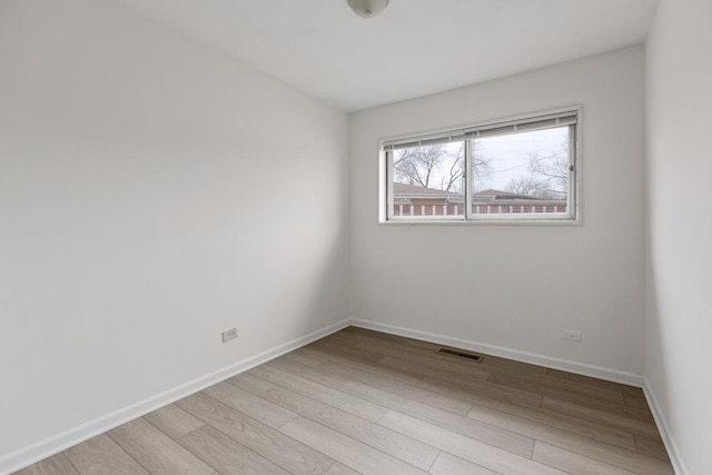 empty room with light wood-type flooring