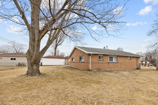 view of side of home featuring a lawn