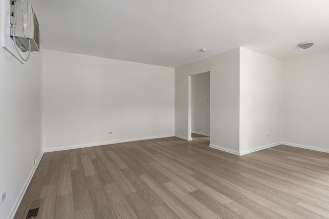 unfurnished room with light hardwood / wood-style floors