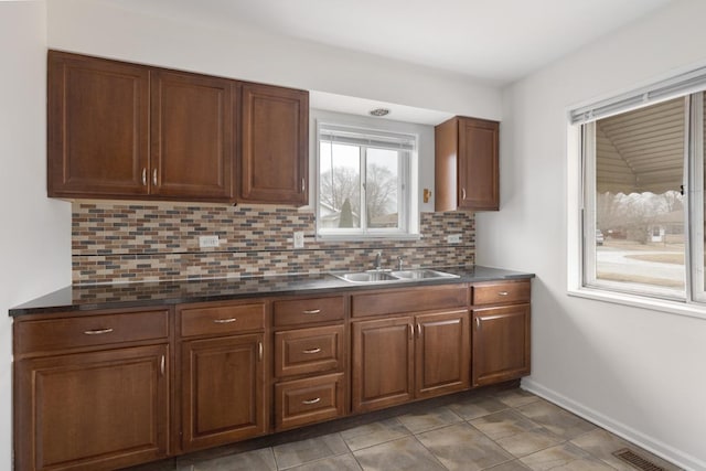 kitchen featuring sink and backsplash