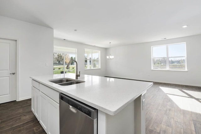 kitchen featuring sink, hanging light fixtures, an island with sink, white cabinets, and stainless steel dishwasher