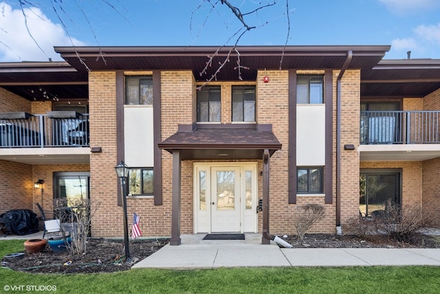 view of front of home featuring brick siding