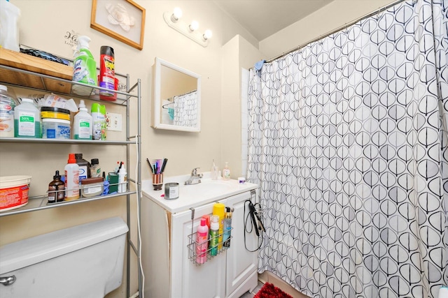 bathroom with sink, a shower with curtain, and toilet