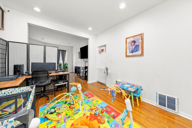 game room with hardwood / wood-style flooring