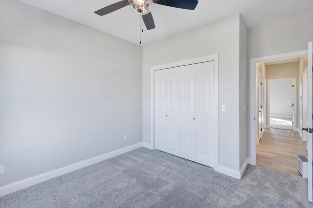 1713 Littlefield Ln, Mahomet, IL 61853 - unfurnished bedroom with light colored carpet, baseboards, a closet, and ceiling fan