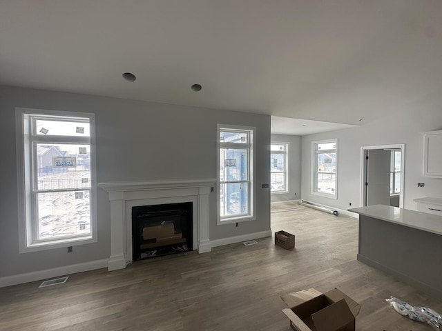 unfurnished living room with light wood-type flooring