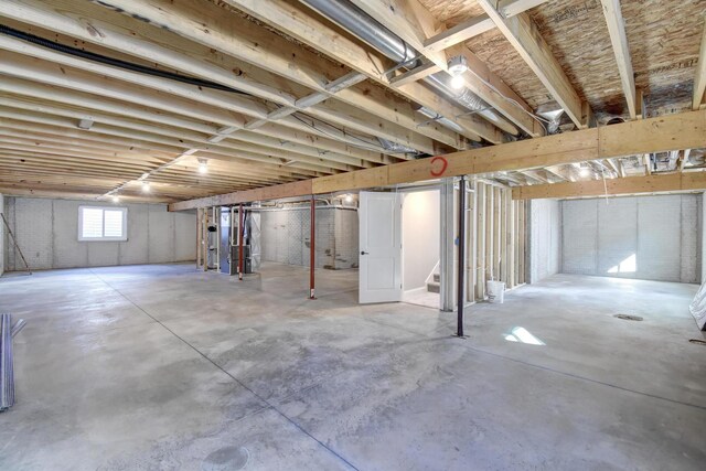 1713 Littlefield Ln, Mahomet, IL 61853 - below grade area featuring stairway and heating unit