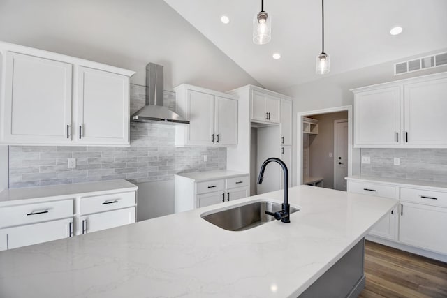 1713 Littlefield Ln, Mahomet, IL 61853 - kitchen featuring wall chimney exhaust hood, a sink, light stone counters, decorative backsplash, and pendant lighting